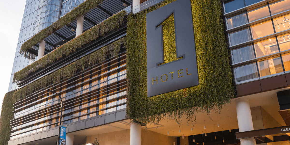 Moss covered 1 Hotels logo on 1 Hotel Nashville facade