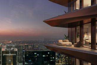 A highrise building with balcony overlooking the city