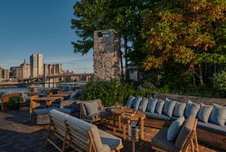 A waterside lounge space at 1 Hotel Brooklyn Bridge.