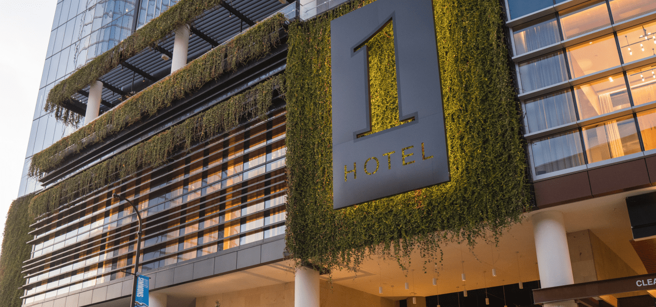 Moss covered 1 Hotels logo on 1 Hotel Nashville facade