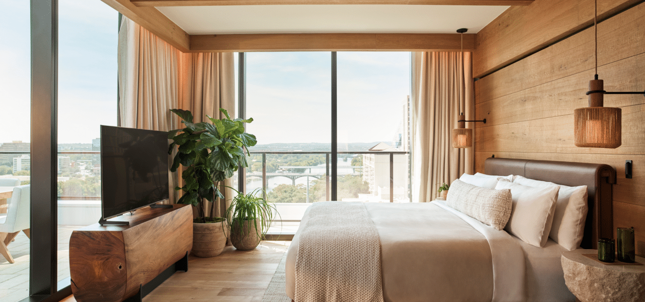 Bedroom of 1 Hotel Austin's Lake Terrace Suite with views of Lady Bird Lake