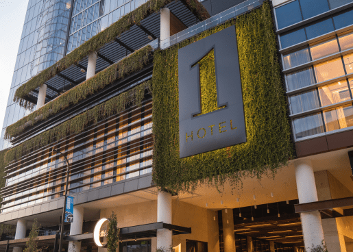 Moss covered 1 Hotels logo on 1 Hotel Nashville facade